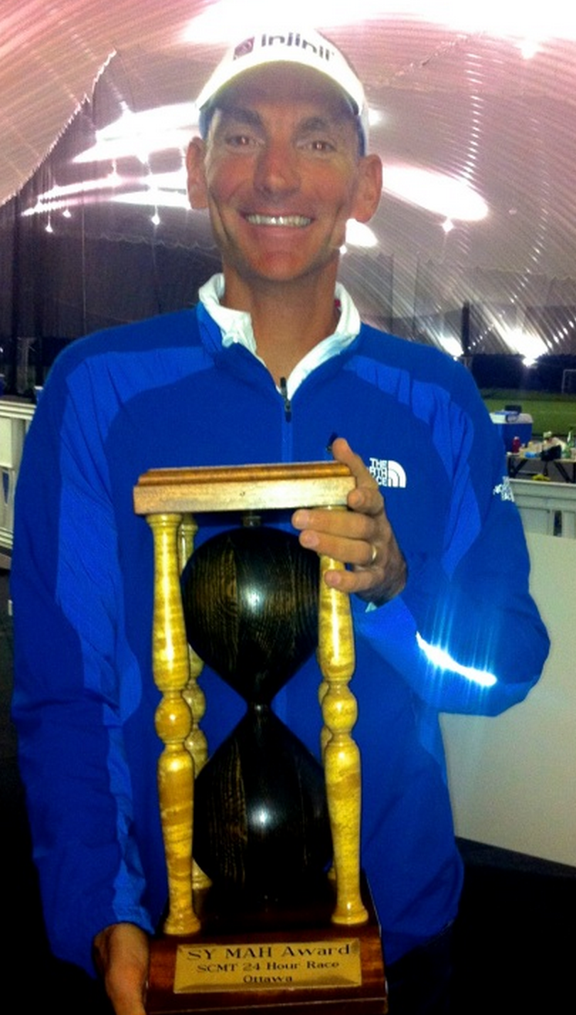 a man holding an hourglass