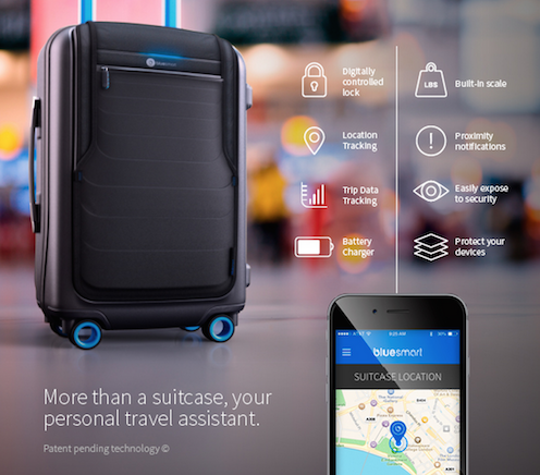a black suitcase with blue wheels and blue wheels next to a cell phone