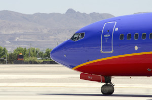 the front of a blue and red airplane