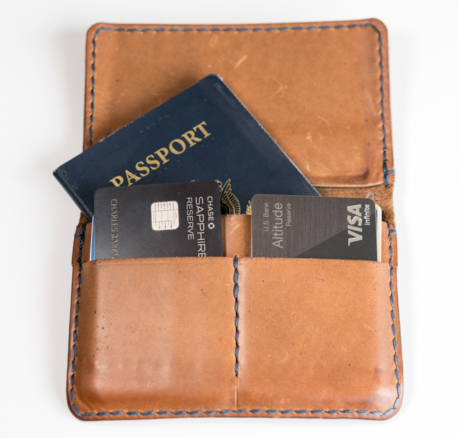 a wallet with a passport and credit cards inside