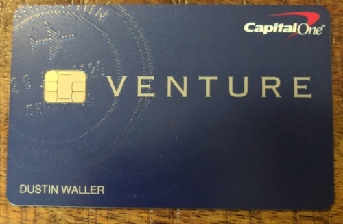 a blue credit card with a gold logo
