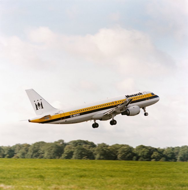 a plane flying over a field