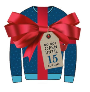 a blue sweater with a red bow and a tag