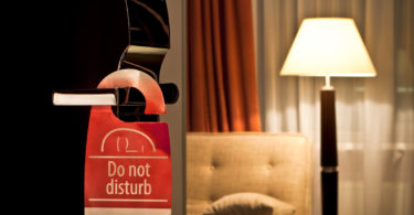 a don't disturb sign on a door handle