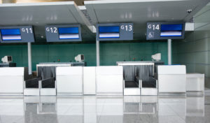 a row of electronic screens in an airport