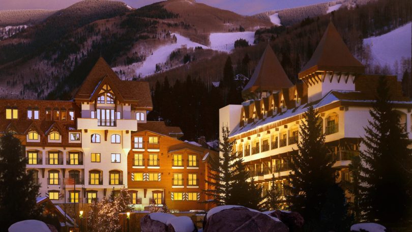 a group of buildings in the mountains