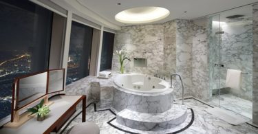 a bathroom with a large tub and a shower