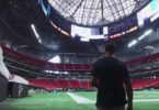 a man walking in a stadium