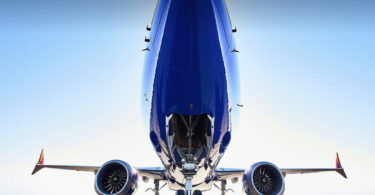 the front of a blue airplane