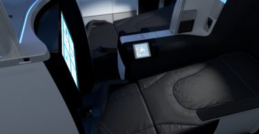 a seat with a screen and a seat belt
