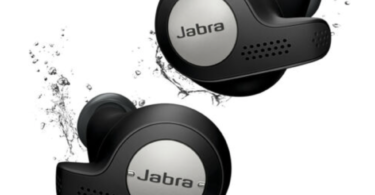 a pair of black earbuds with water splashing