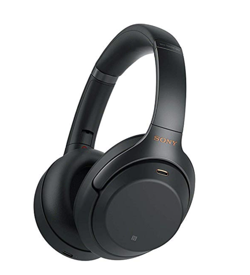 a black headphones with a gold logo