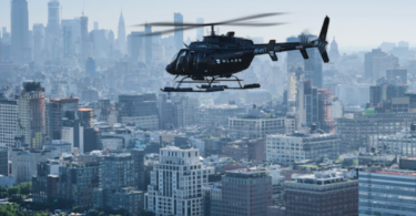 a helicopter flying over a city