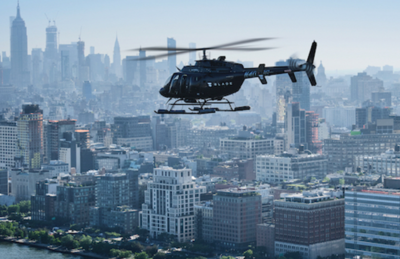 a helicopter flying over a city