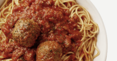 a bowl of spaghetti with meatballs and sauce