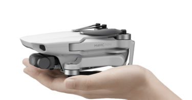 a hand holding a drone