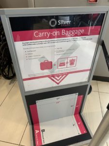 a sign with a suitcase on it