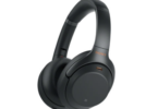 a black headphones with orange lettering