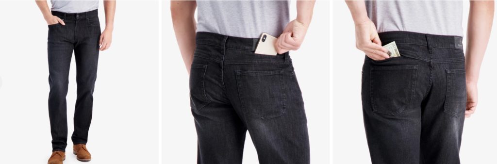 a person holding a phone in their pocket