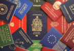a group of passport with different colors of passport