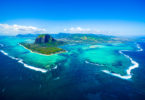 an island with a mountain in the background