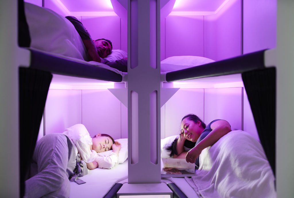 a group of people sleeping in bunk beds