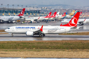 a group of airplanes on a runway