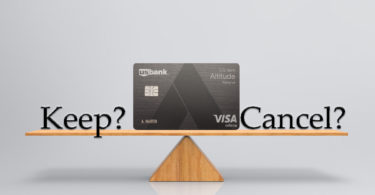 a credit card on a seesaw
