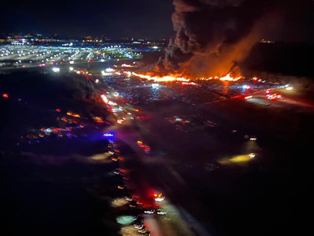 a fire in a city at night