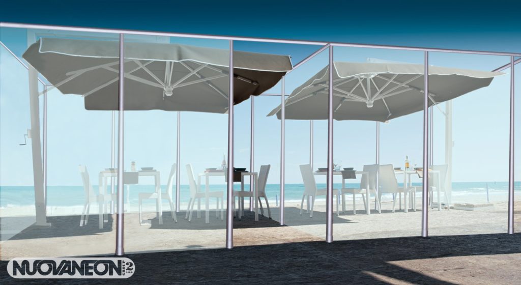 a glass structure with tables and chairs