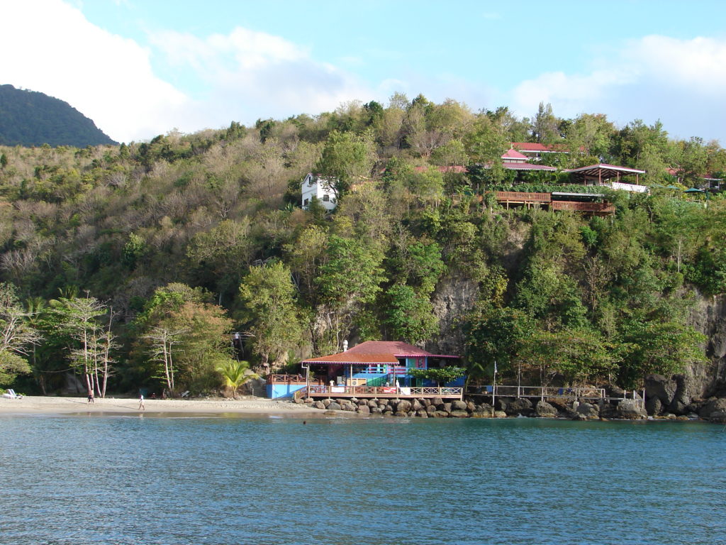 a house on a hill by water