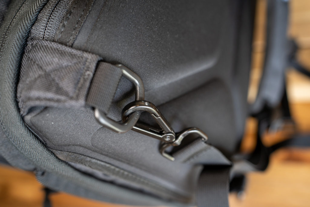 a black bag with a snap hook