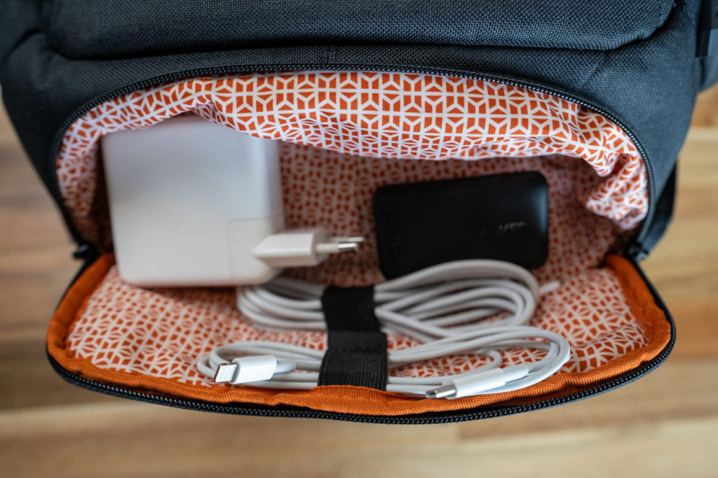 a bag with a power cord and a charger inside