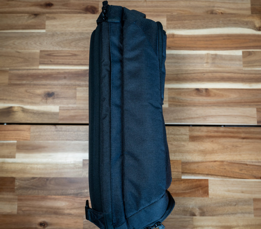 a black bag on a wood floor