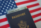a passport and a card on a flag