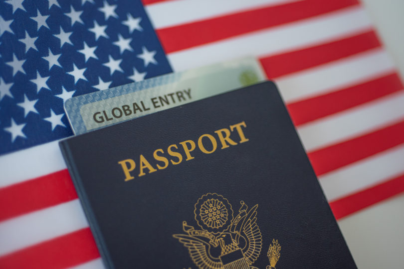 a passport and a card on a flag
