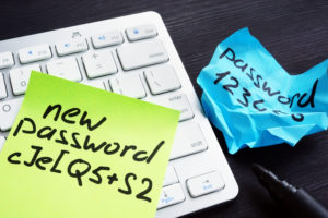 a keyboard and note with a pen and a note on it