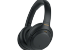 a black headphones with a yellow logo