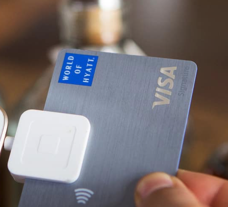a person holding a credit card