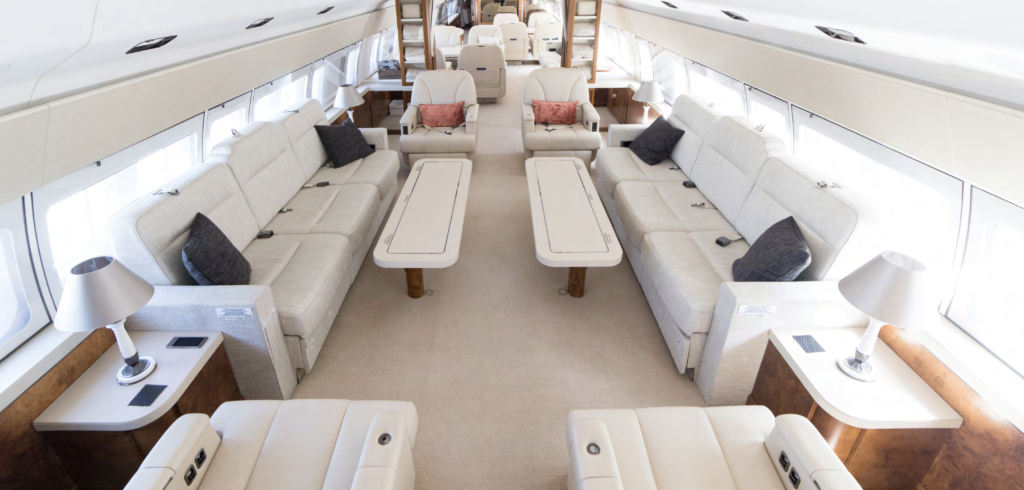 a large white airplane with many white couches