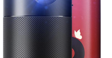 a black speaker next to a red can