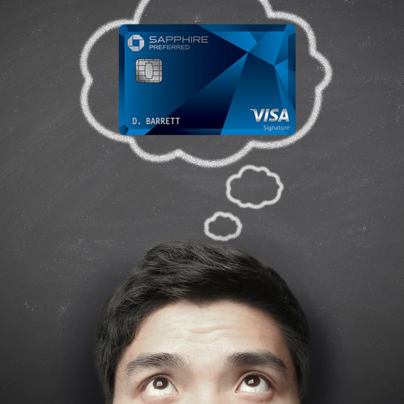 a man looking up at a credit card