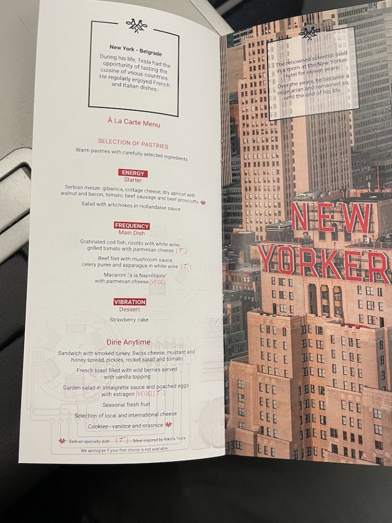 a menu with a picture of a city