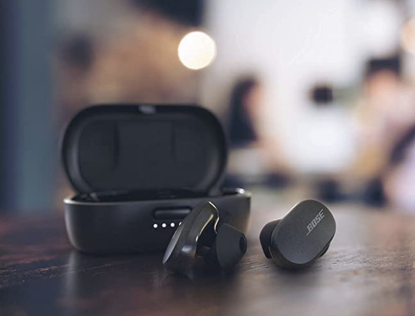 a pair of wireless earbuds on a table