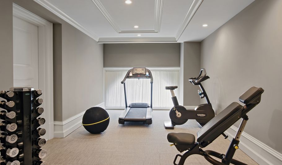 a room with exercise equipment and a treadmill