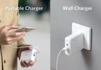 a person holding a phone and charging a wall charger