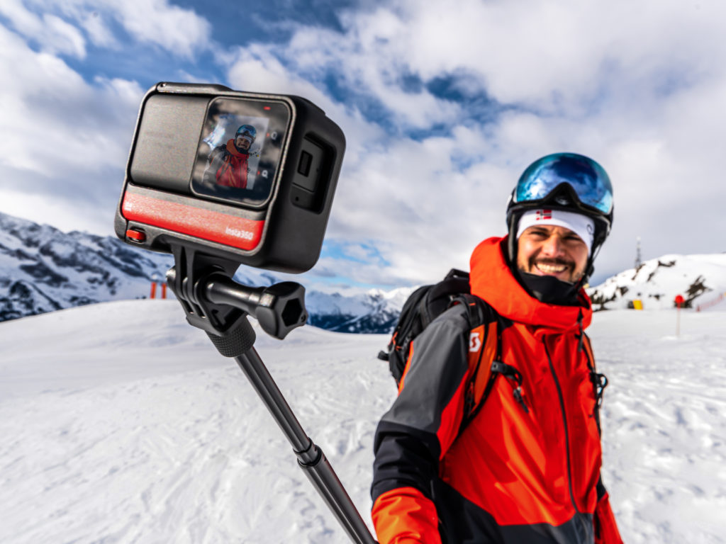 a man taking a selfie on a snowy mountain