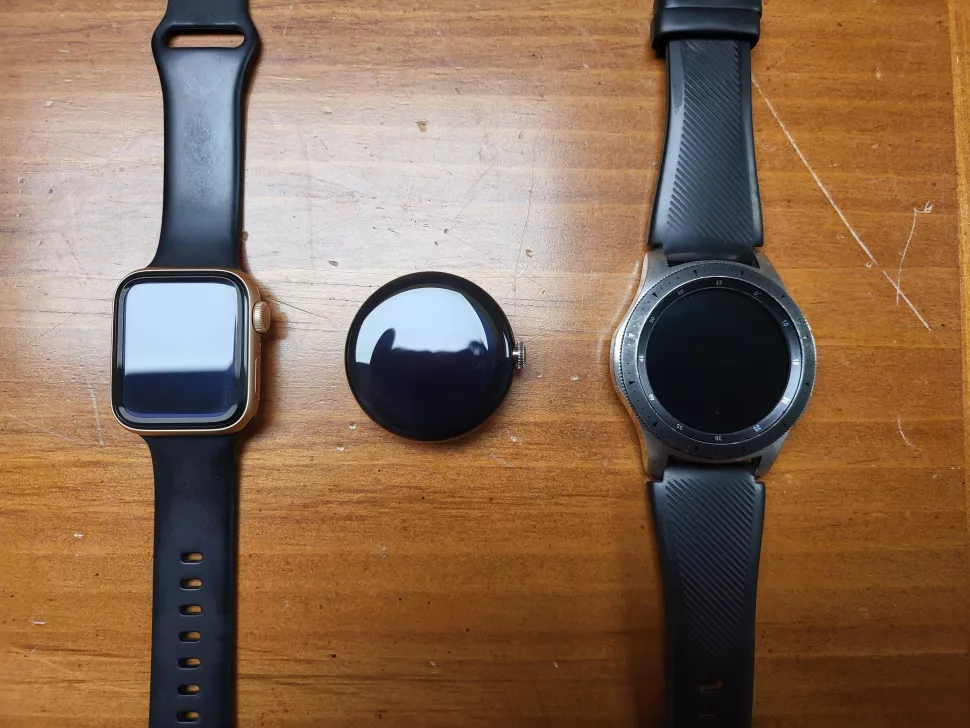 a group of smart watches on a table
