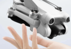 a hand holding a drone
