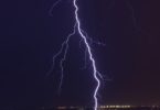 lightning bolt of lightning striking a city at night